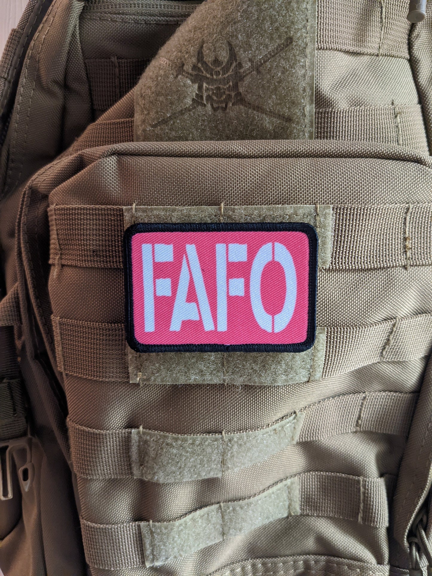 Fuck around and find out pink funny 2"x3" morale patch with hook and loop backing green background