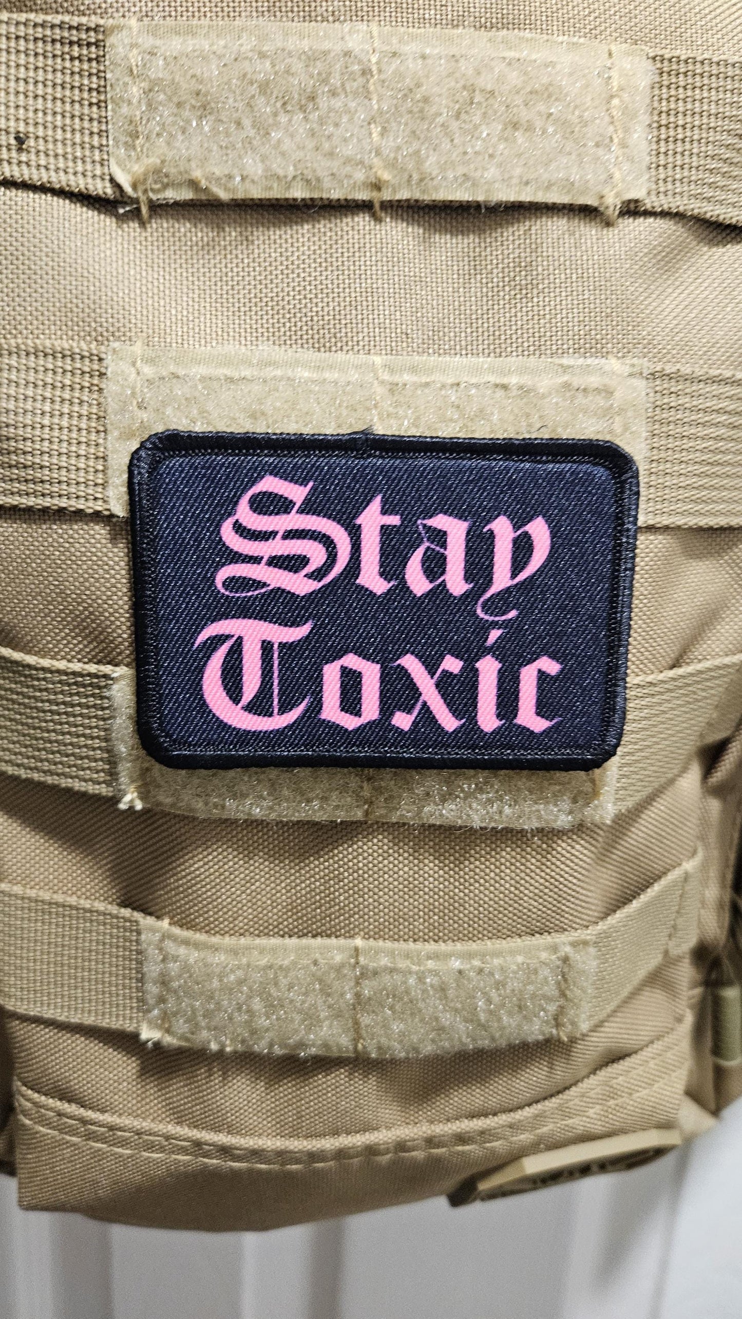 Stay toxic meme  pink on black 2"x3" removable morale patch with hook and loop backing