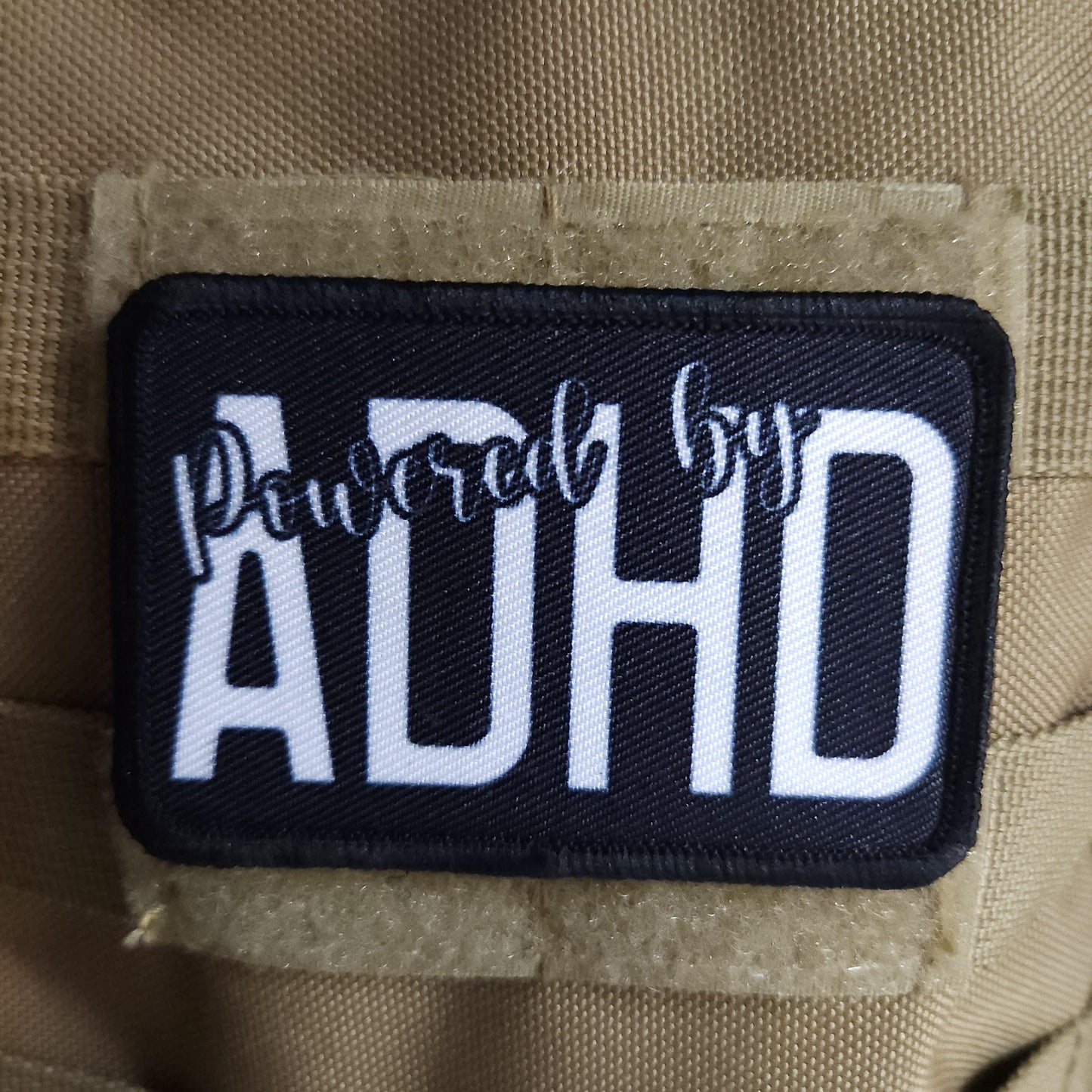 Powered by ADHD meme  2"x3" morale patch with hook and loop backing