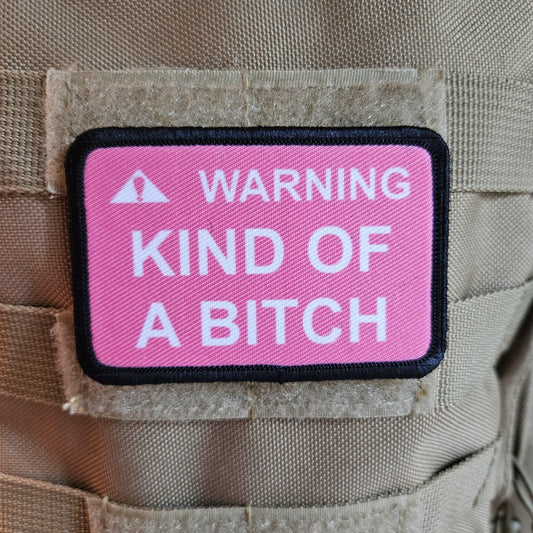 Warning kind of a bitch patch 2"x3" removable morale patch with hook and loop backing pink