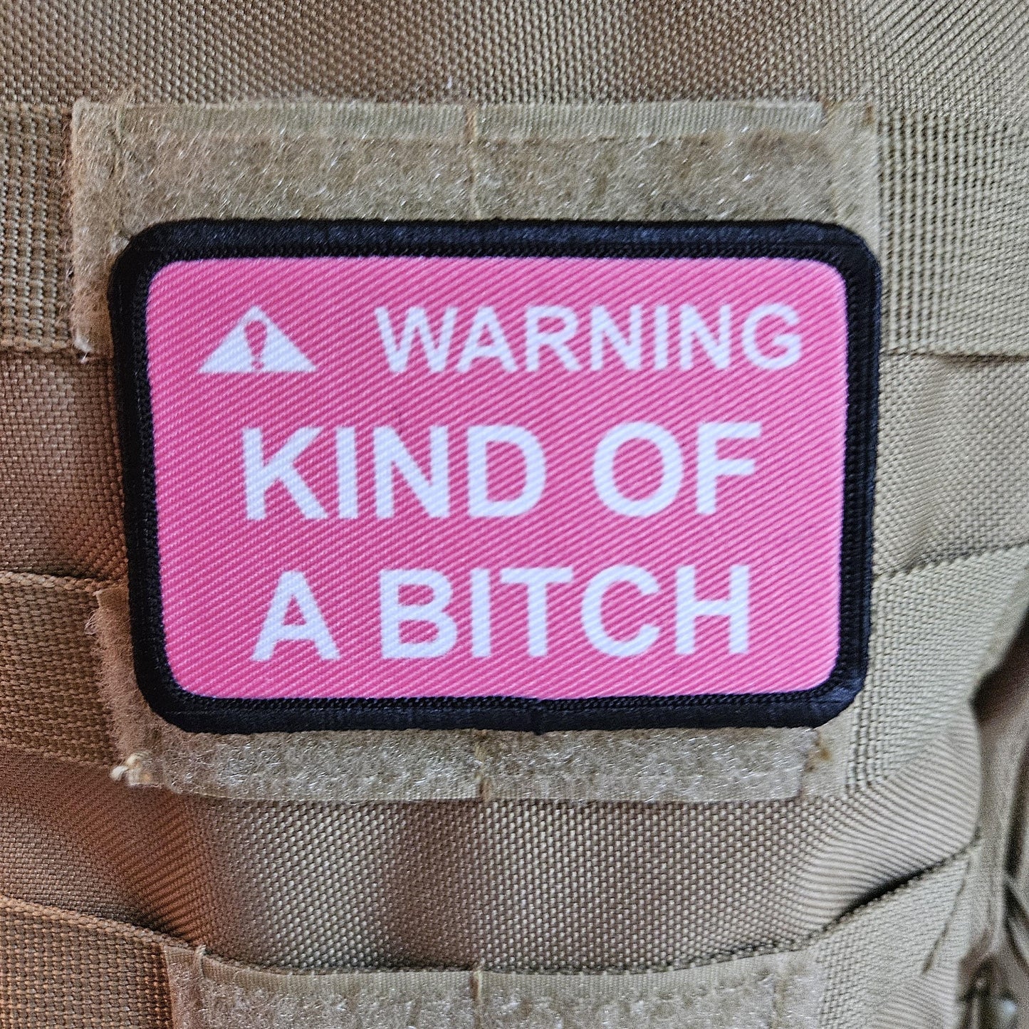 Warning kind of a bitch patch 2"x3" removable morale patch with hook and loop backing pink