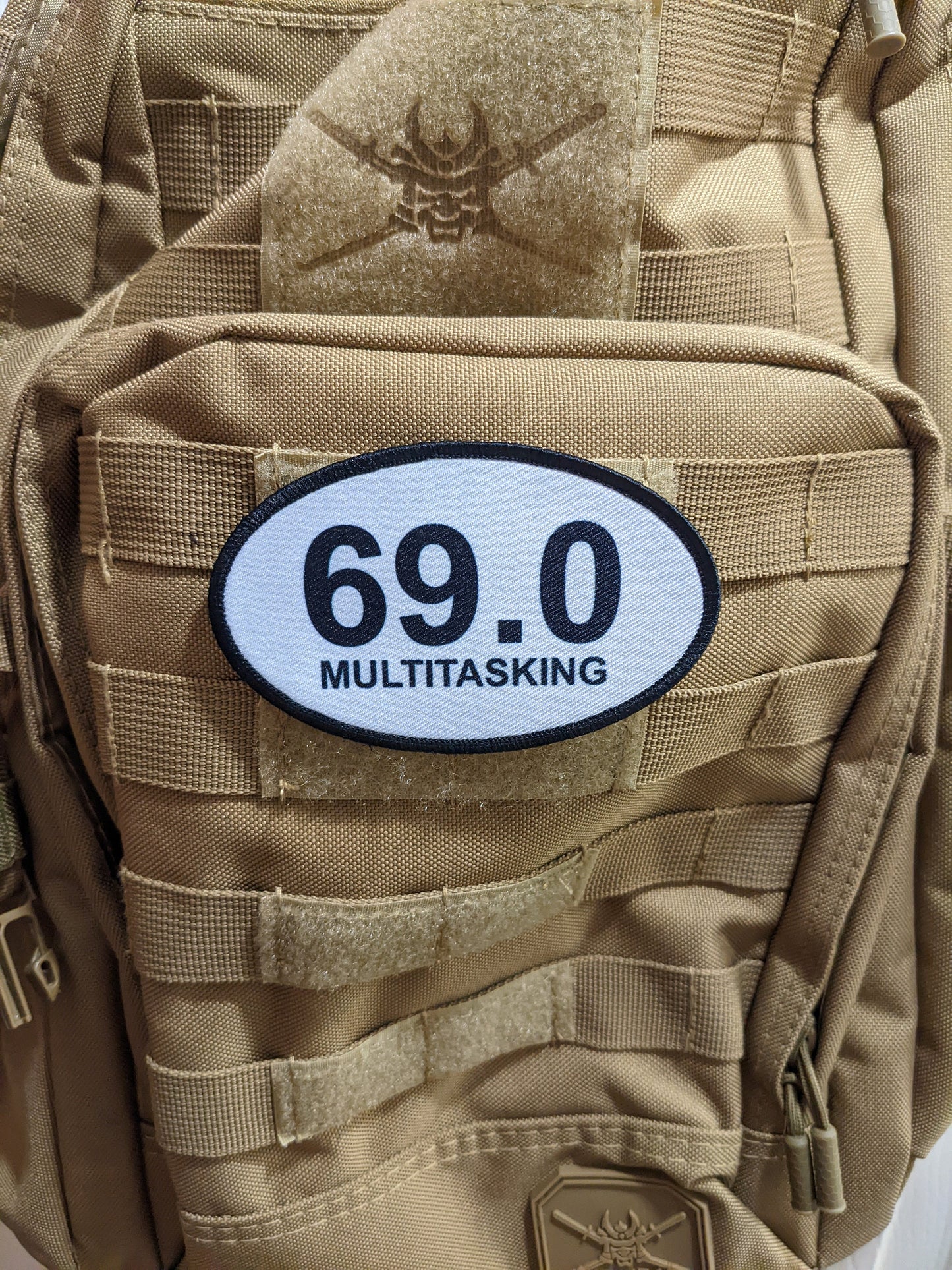 69 multitasking celebration joke  4"x2.5" oval morale patch with hook and loop backing