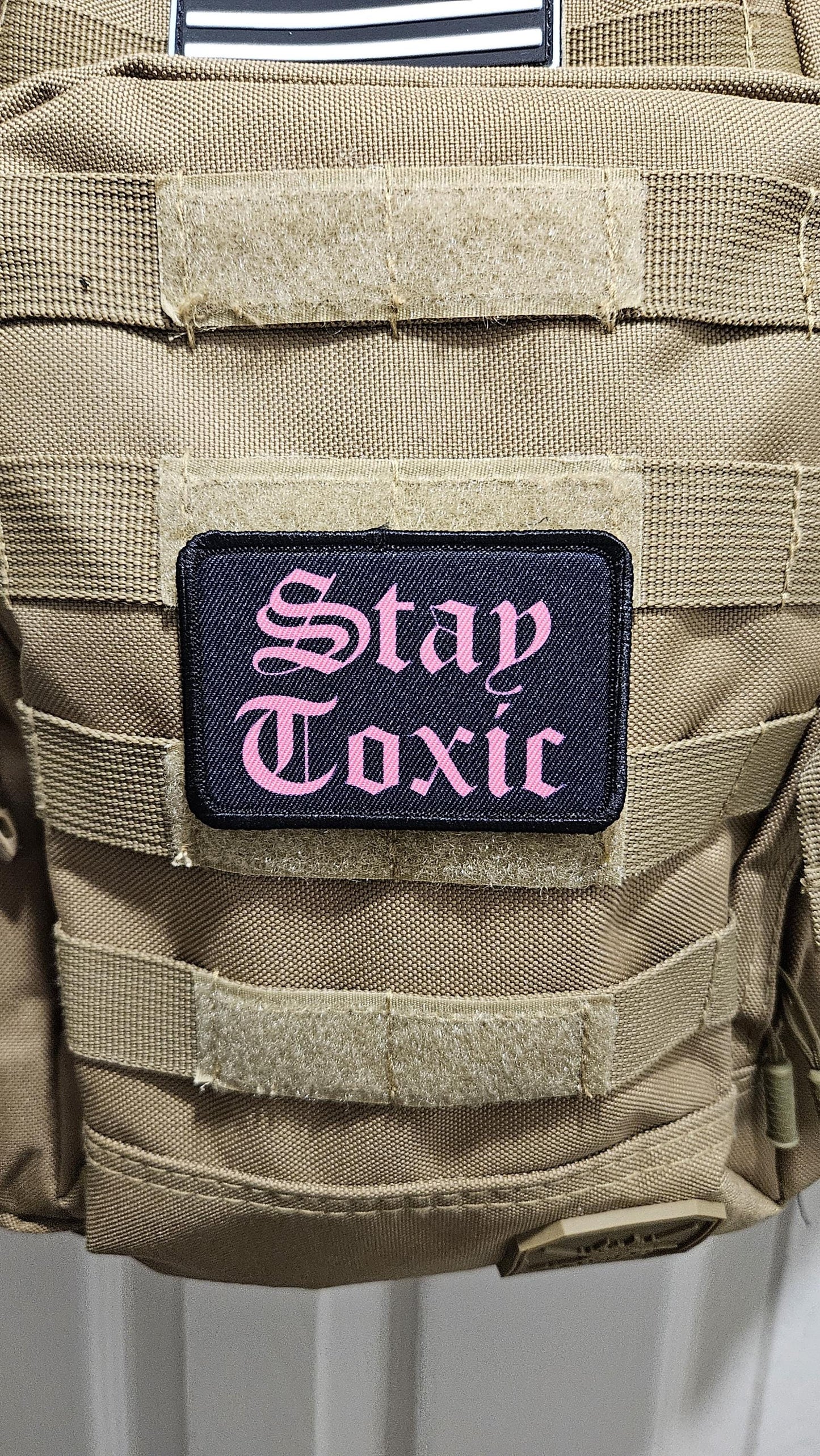 Stay toxic meme  pink on black 2"x3" removable morale patch with hook and loop backing