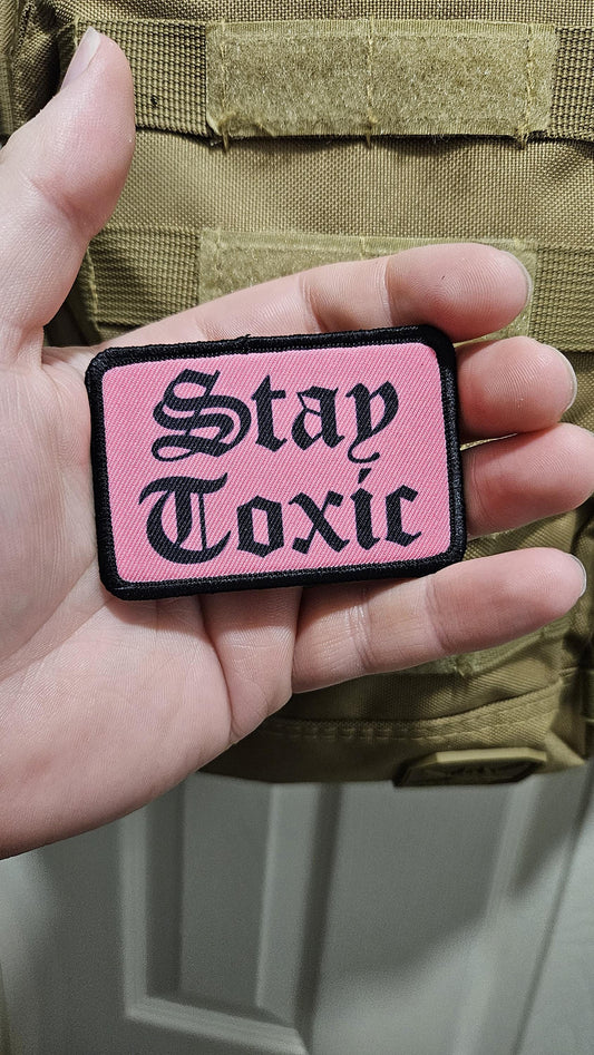 Stay toxic meme  black on pink 2"x3" removable morale patch with hook and loop backing