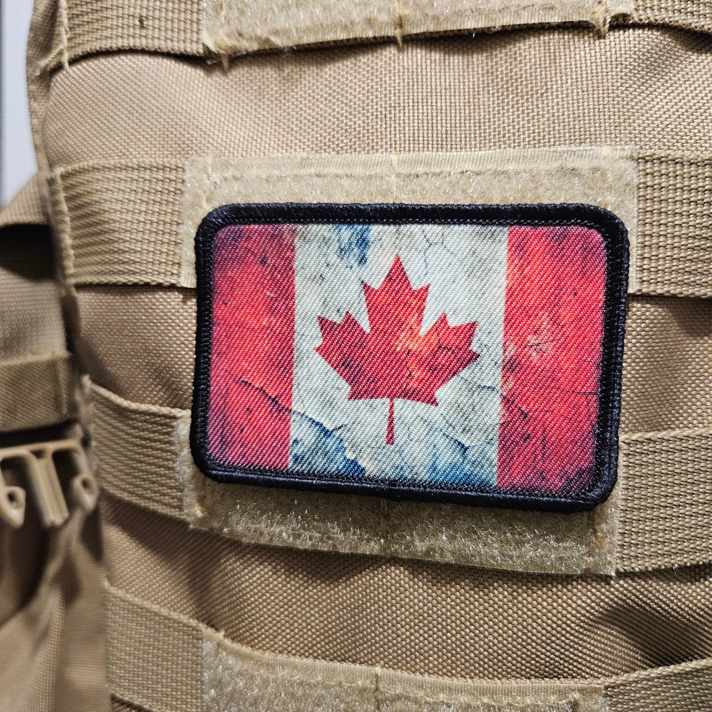 Distressed Canadian maple leaf flag 2"x3" morale patch with hook and loop backing