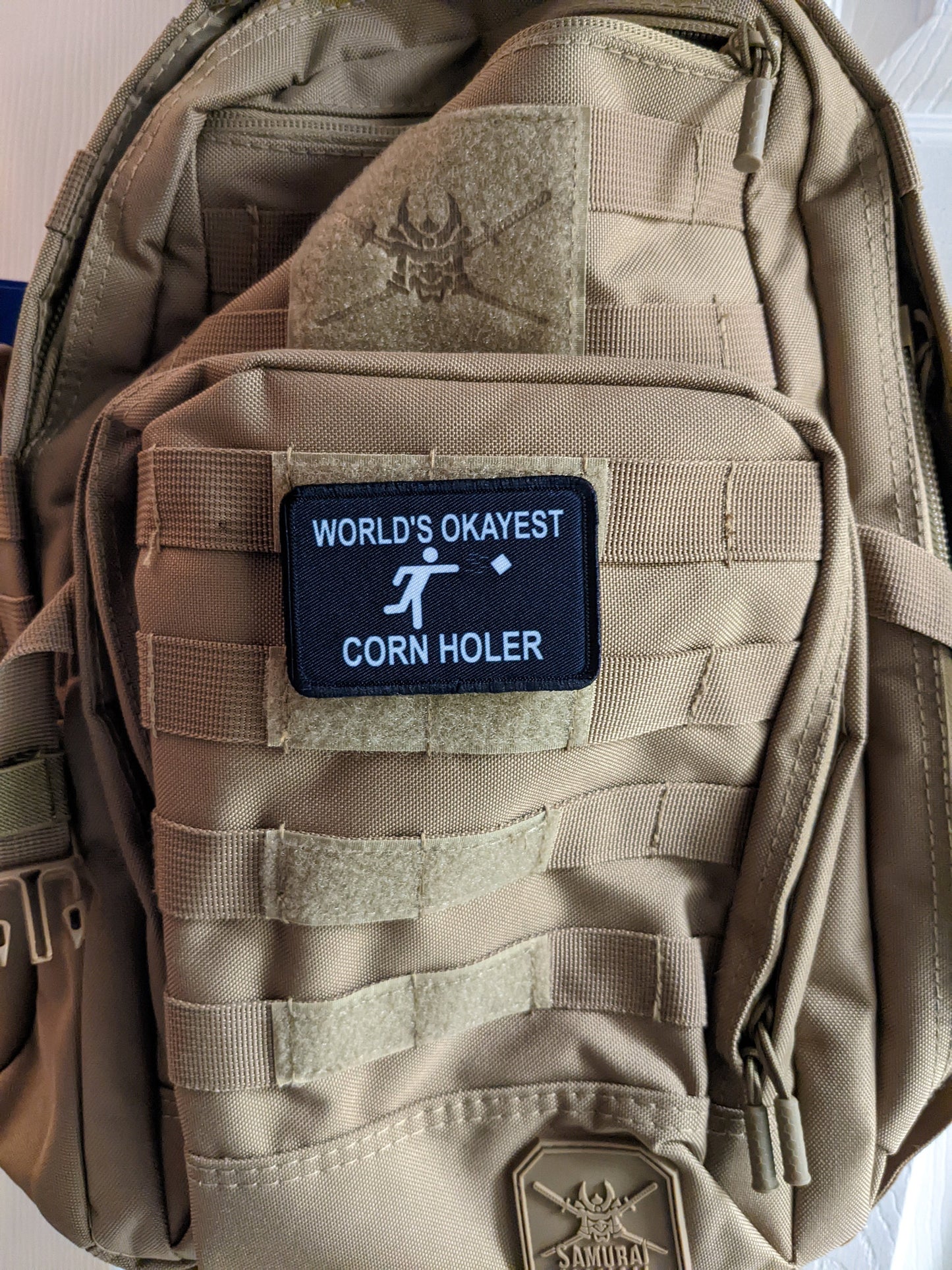 World's Okayest corn hole player funny meme 2"x3" morale patch with hook and loop backing