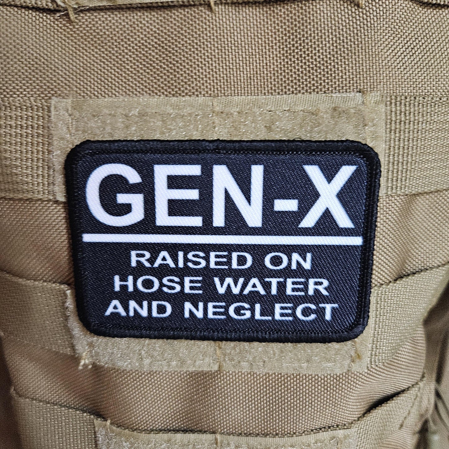 Gen x raised on hose water and neglect meme 2"x3" morale patch with hook and loop backing