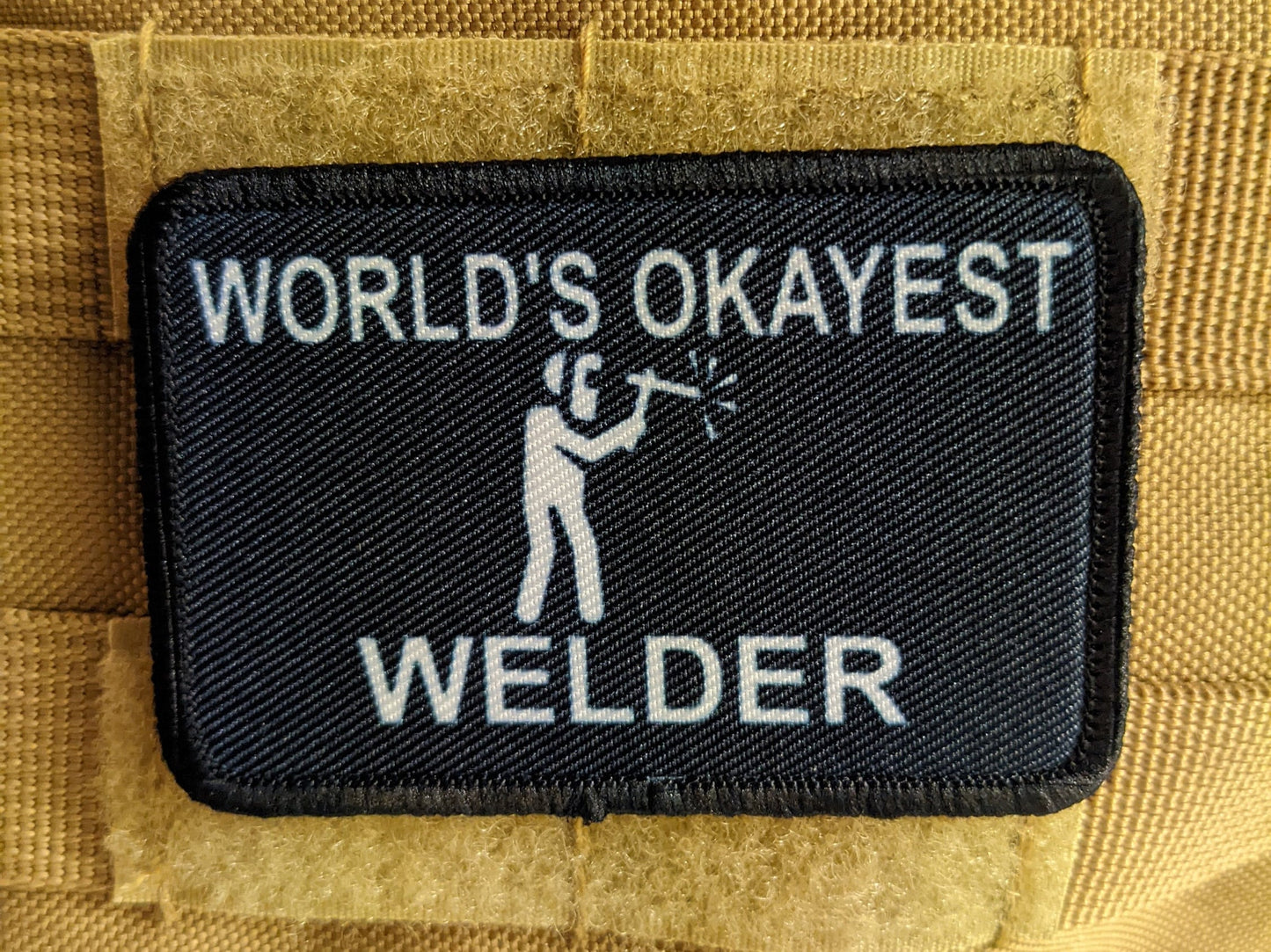 World's okayest Welder blue collar welding 2"x3" morale patch with hook and loop backing