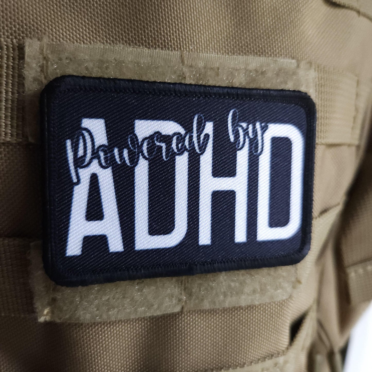 Powered by ADHD meme  2"x3" morale patch with hook and loop backing