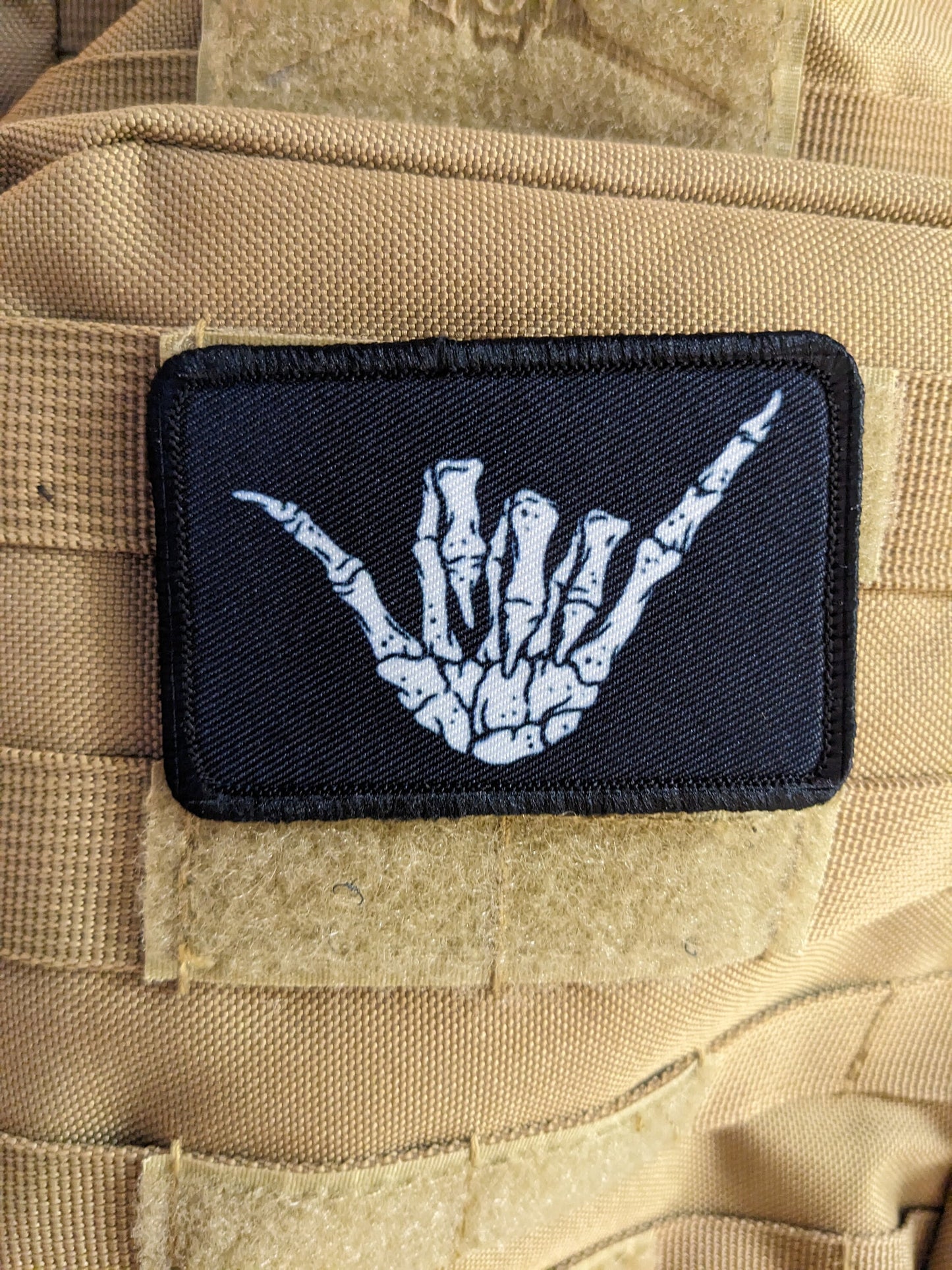Bone shaka punk goth joke 2"x3" white morale patch with hook and loop backing