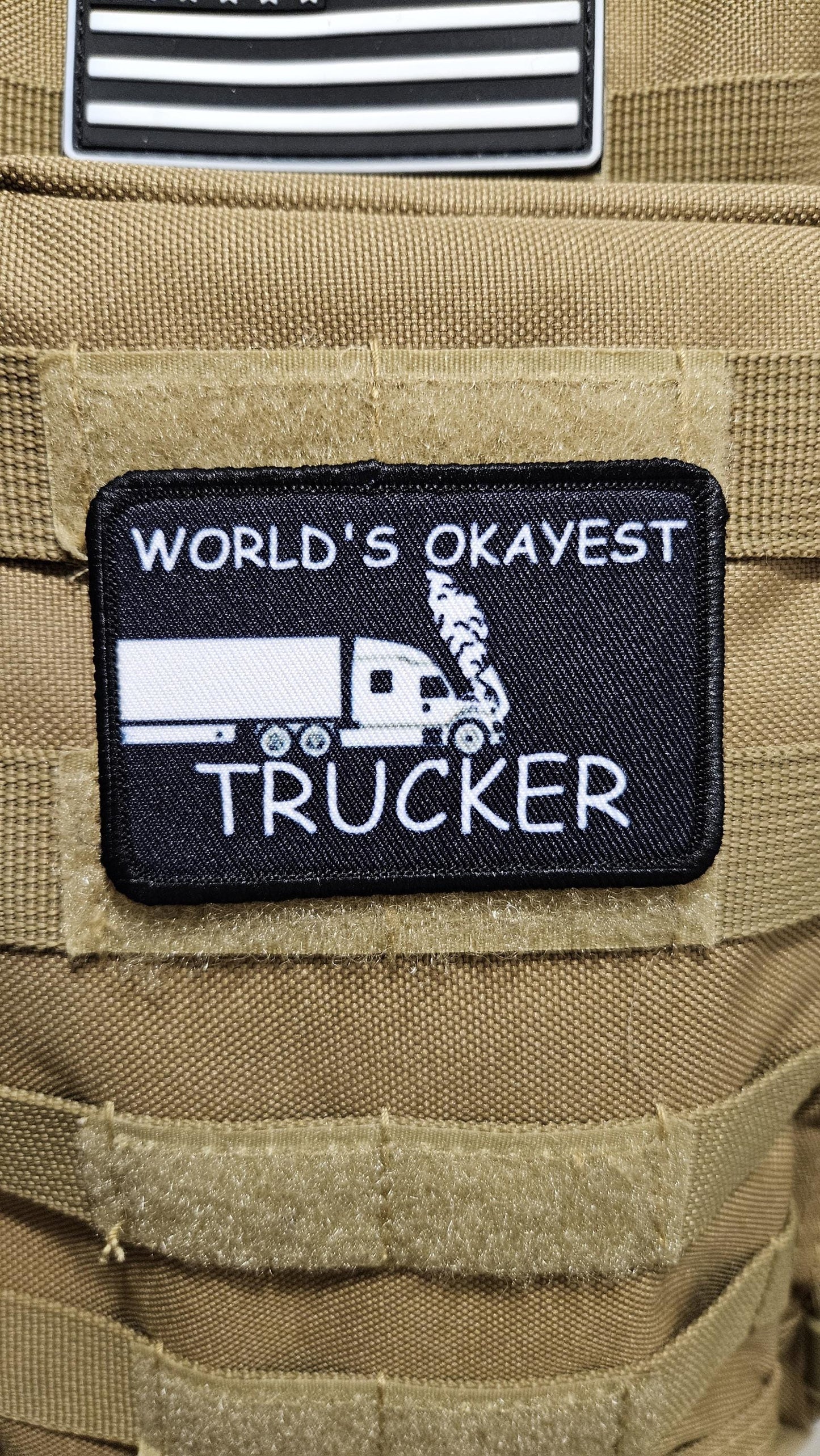 World's okayest trucker blue collar 2"x3" morale patch with hook and loop backing