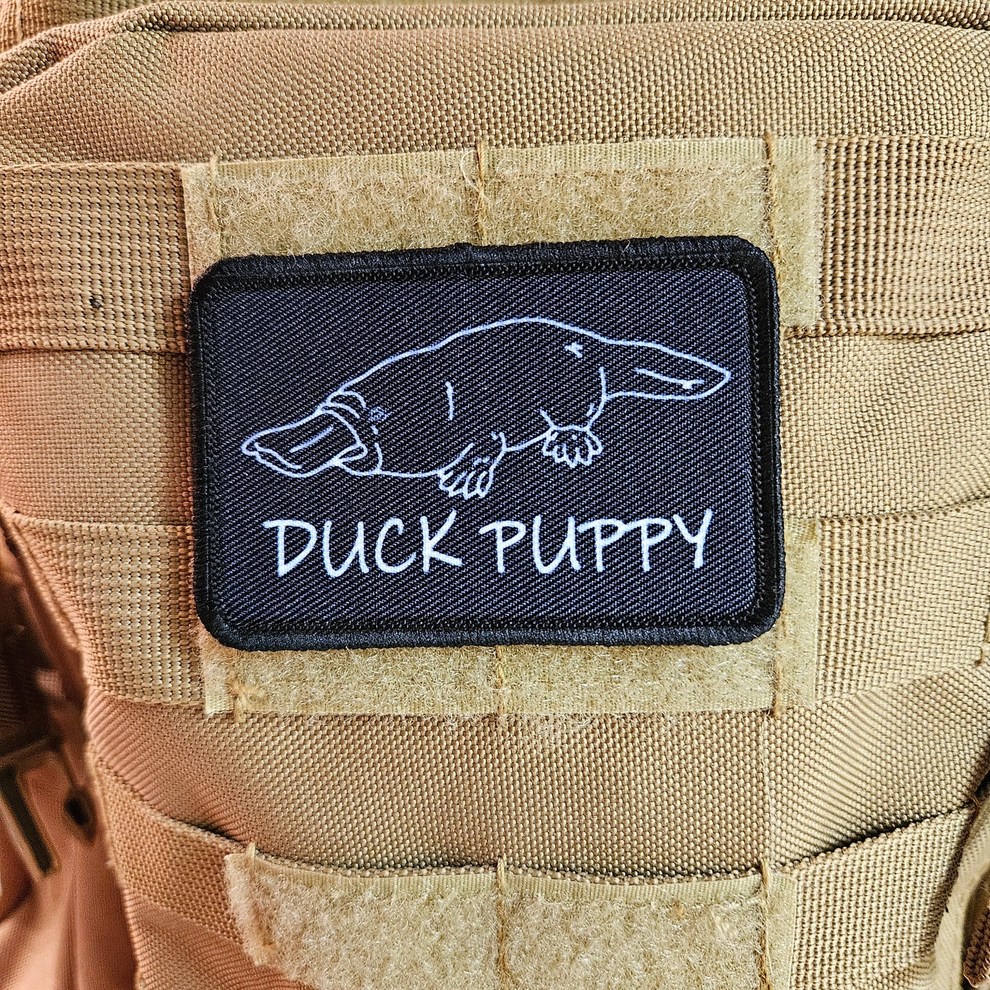 Duck puppy duck billed platypus black meme funny  2"x3" morale patch with hook and loop backing