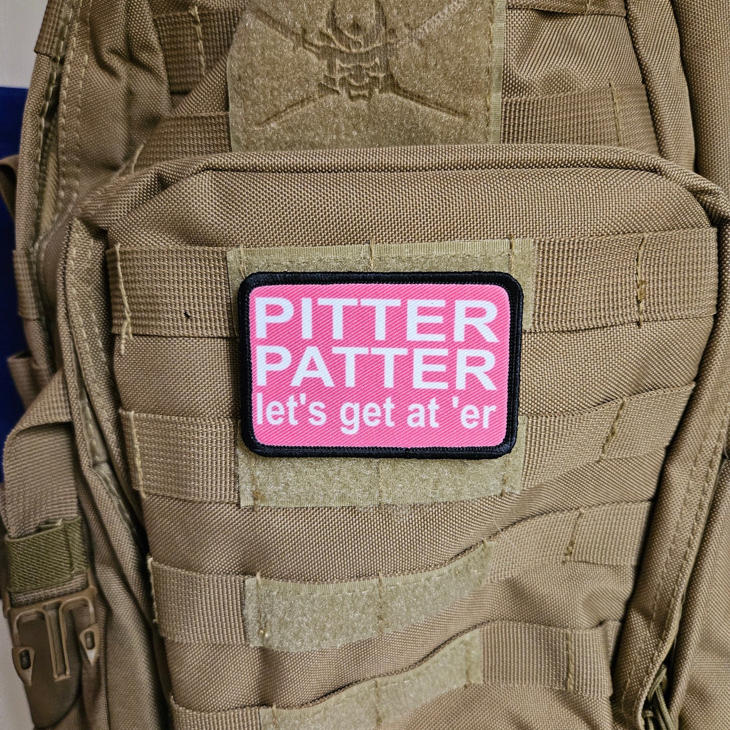 pink and white Pitter patter let's get at 'er meme 2"x3" removable morale patch with hook and loop backing