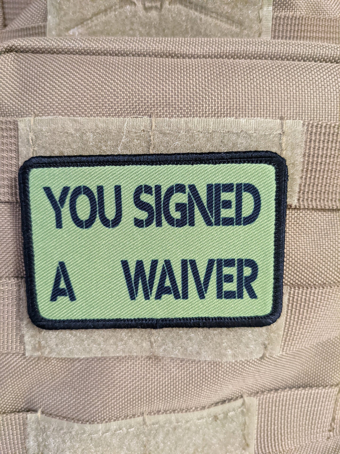 You signed a waiver  removable patch 2"x3" morale patch with hook and loop backing