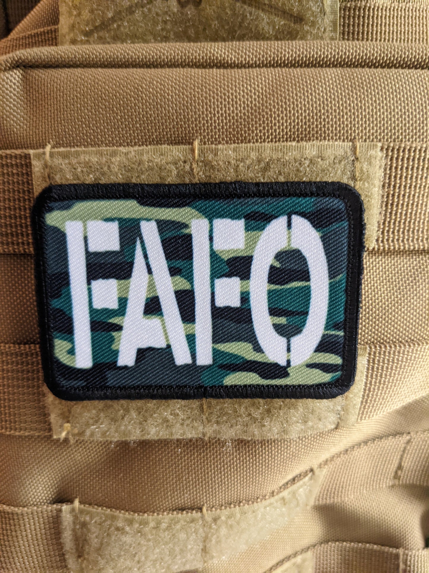 Fuck around and find out camo funny 2"x3" morale patch with hook and loop backing green background
