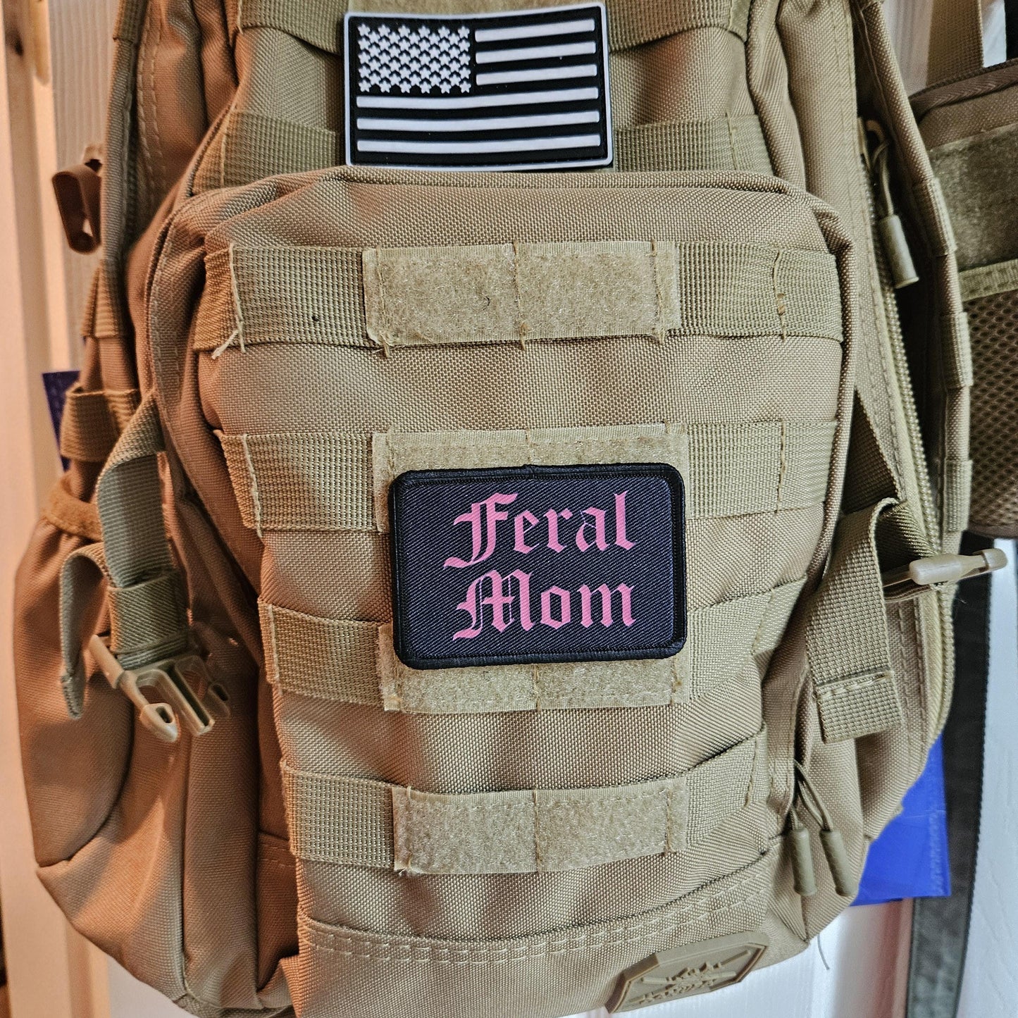 Pink on black "feral mom" girls and boys meme 2"x3" morale patch with hook and loop backing