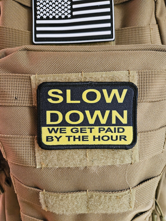 Slow down we get paid by the hour 2"x3" morale patch with hook and loop backing blue collar