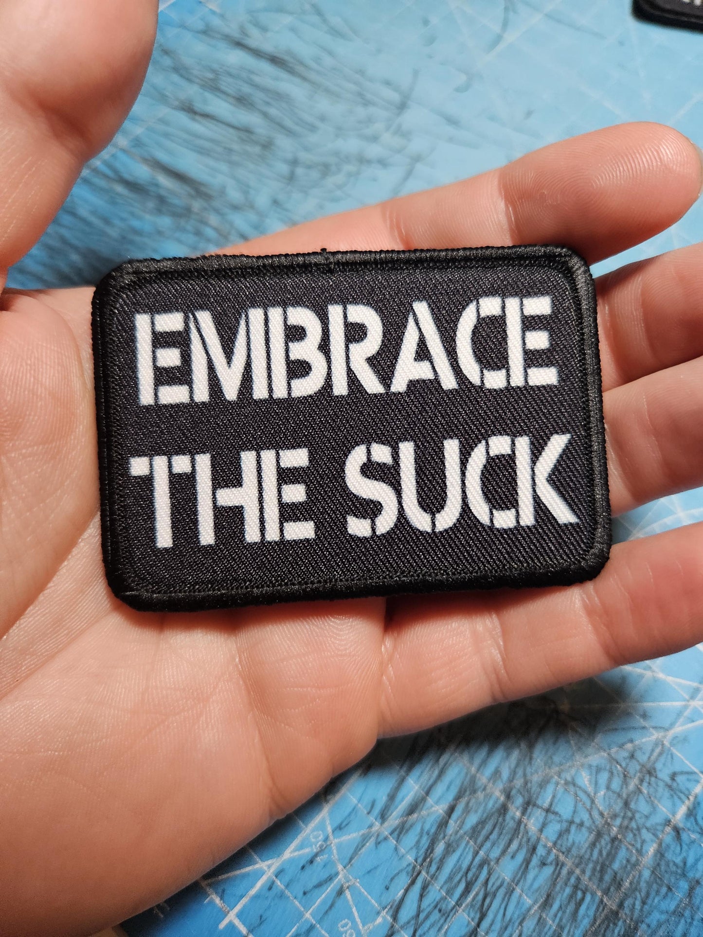 EMBRACE THE SUCK army military navy funny 2"x3" morale patch with hook and loop backing green background