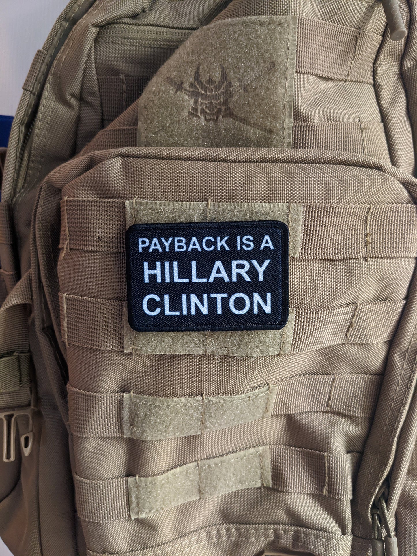 Payback is a Hillary Clinton (bitch) 2"x3" morale patch with hook and loop backing