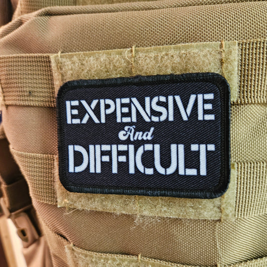 Expensive  and difficult meme black 2"x3" removable morale patch with hook and loop backing