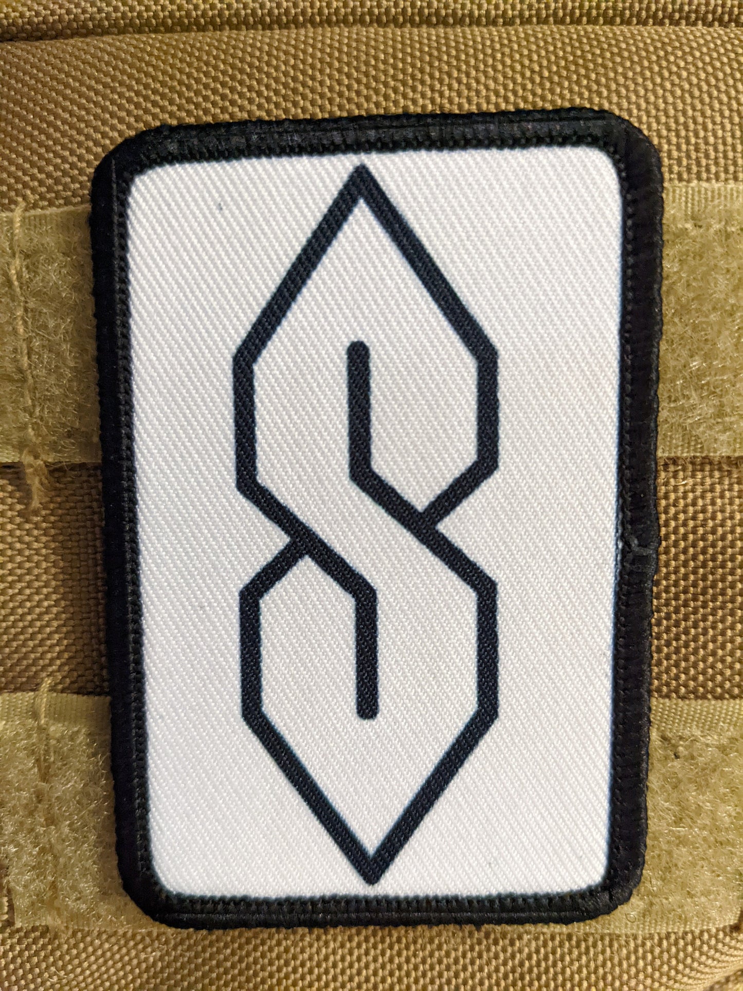 90s "S" shape drawing ancient meme knowledge white 2"x3" morale patch with hook and loop backing