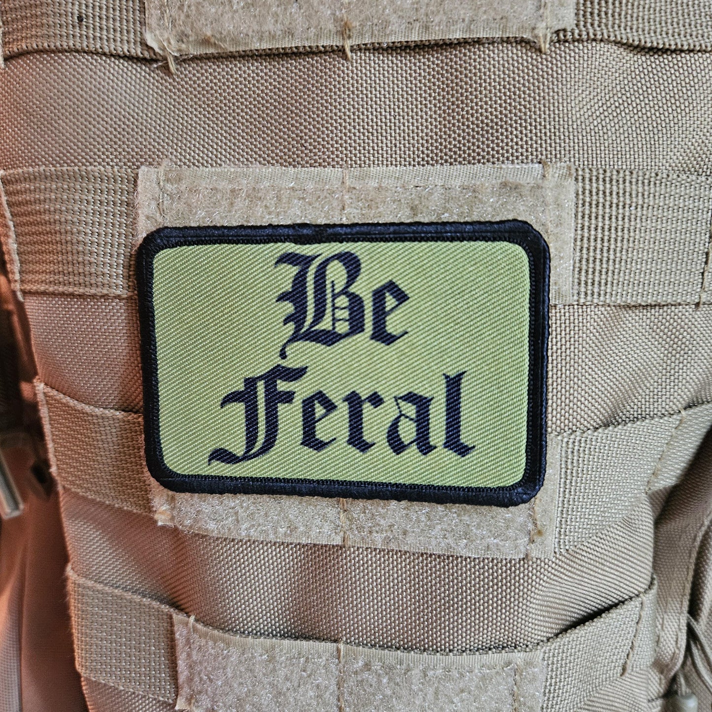 Green "be feral" girls and boys meme 2"x3" morale patch with hook and loop backing