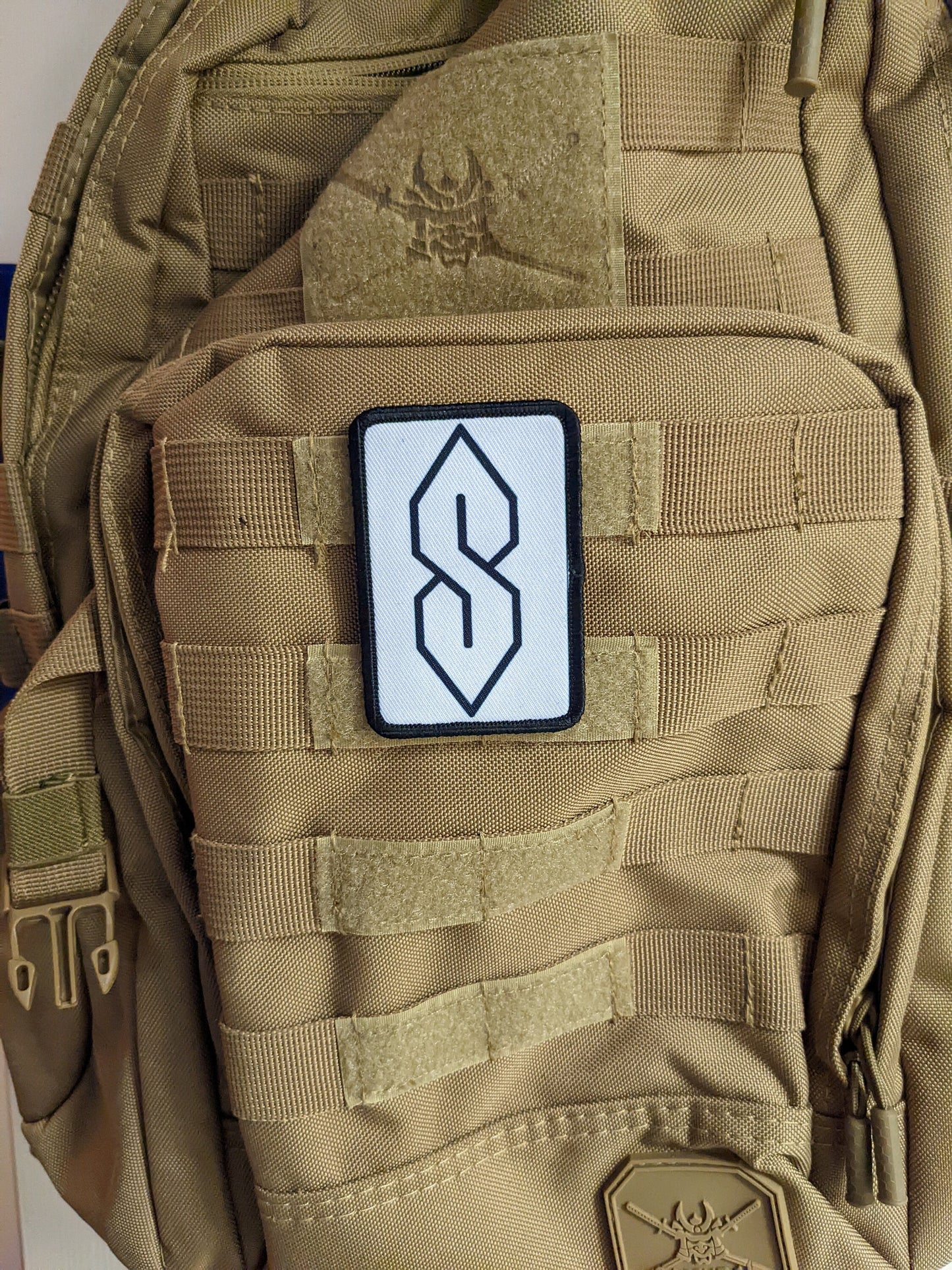 90s "S" shape drawing ancient meme knowledge white 2"x3" morale patch with hook and loop backing