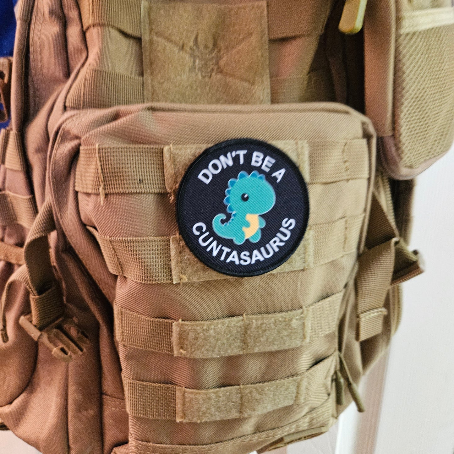 Don't be a cuntasaurus dinosaur meme green version 3" circle removable morale patch with hook and loop backing