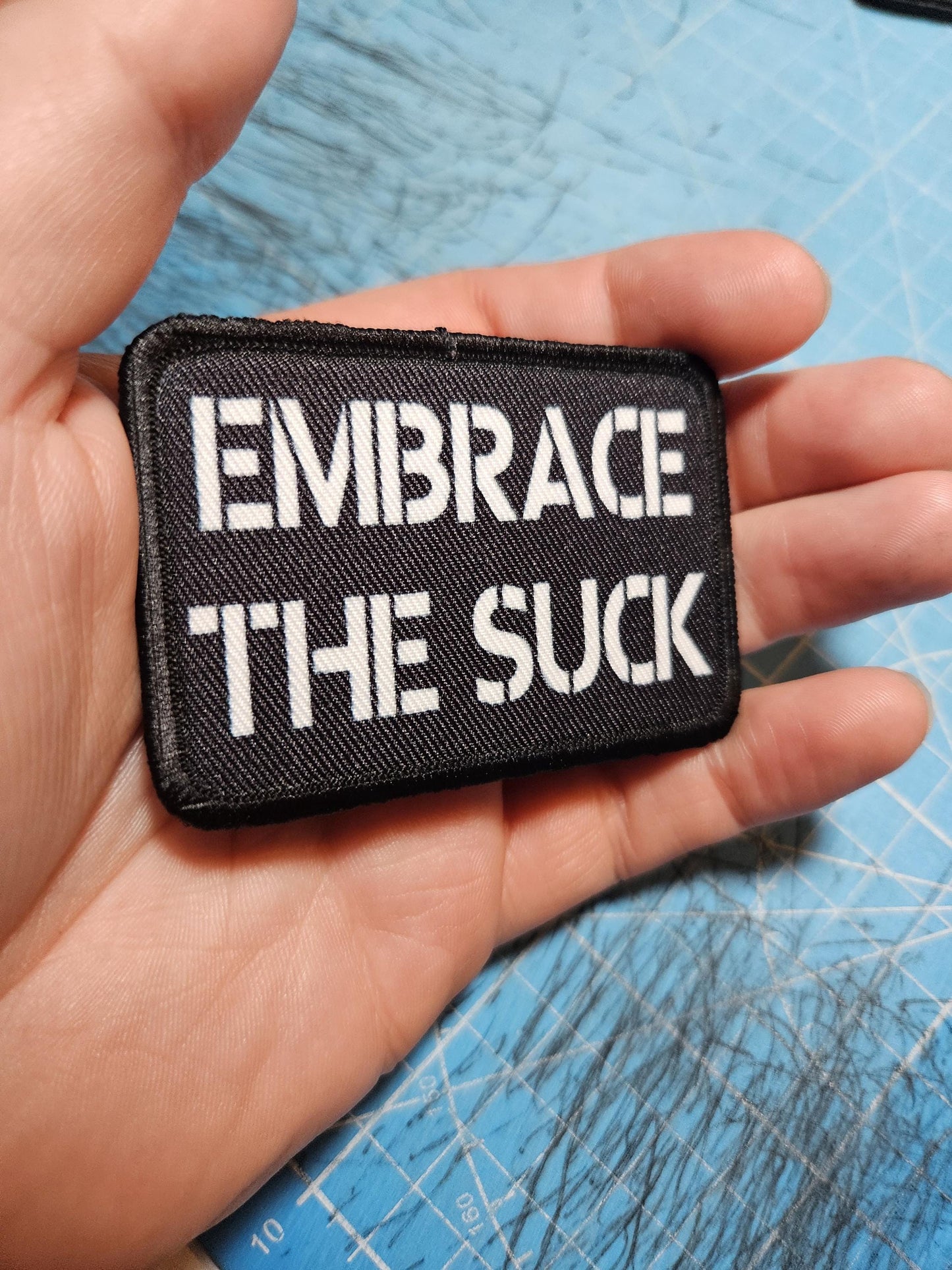 EMBRACE THE SUCK army military navy funny 2"x3" morale patch with hook and loop backing green background