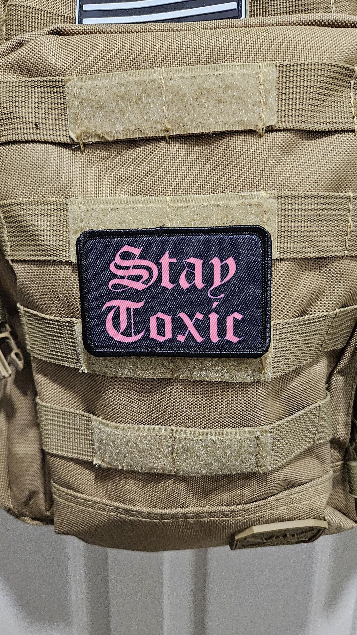 Stay toxic meme  pink on black 2"x3" removable morale patch with hook and loop backing