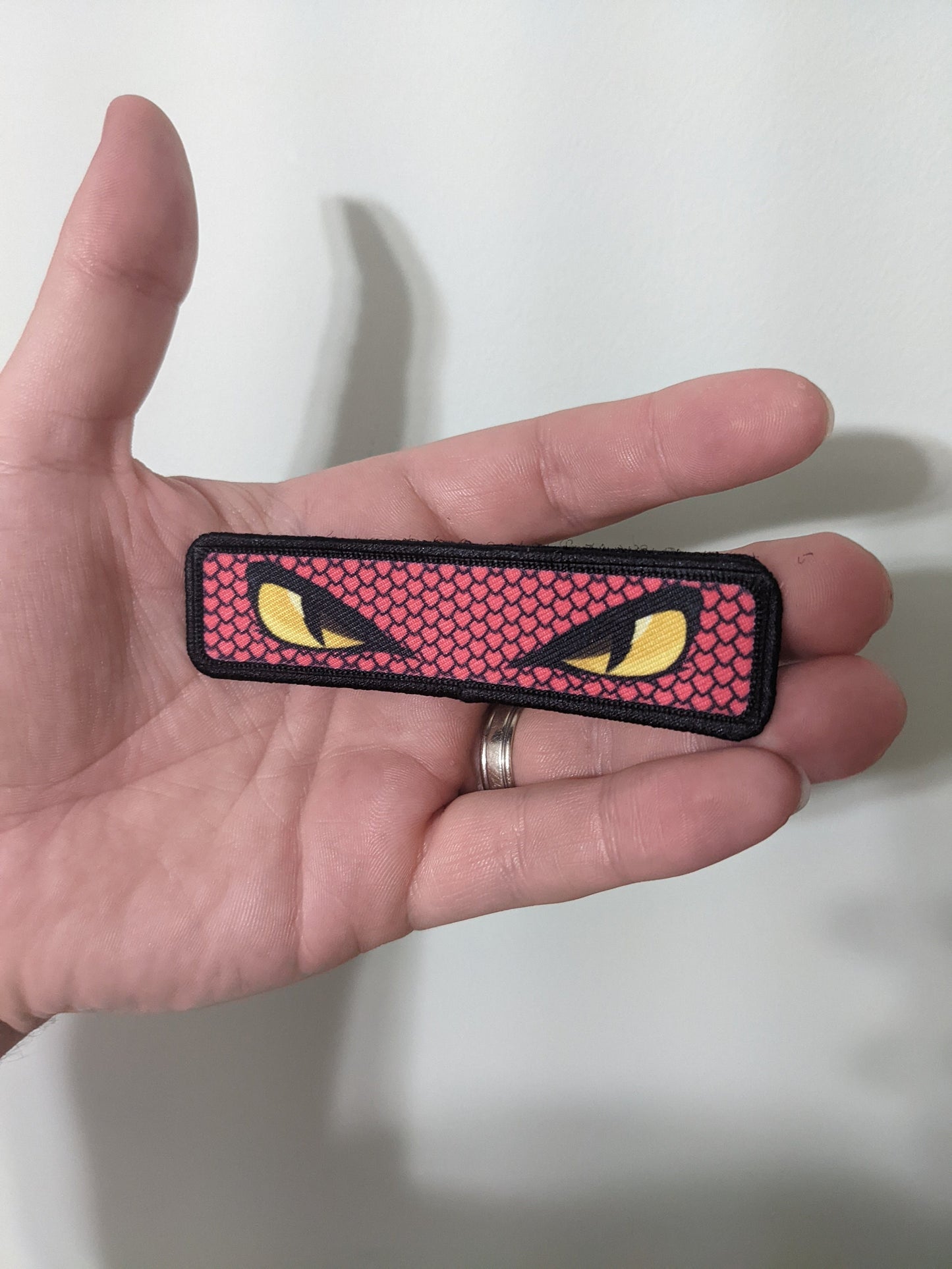 Snake eyes viper eyes pink 1"x4" removable morale patch with hook and loop backing good for back of operator hats