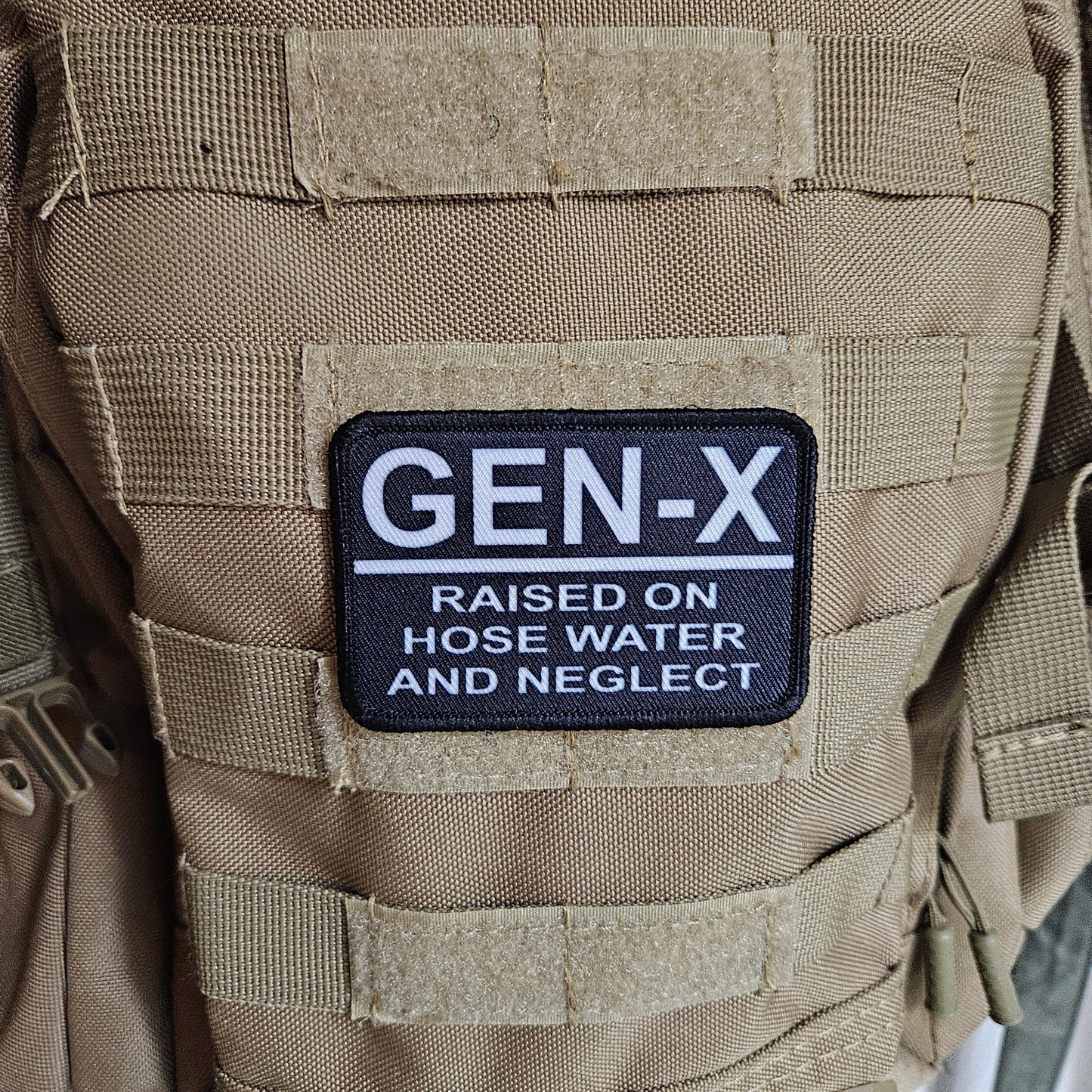 Gen x raised on hose water and neglect meme 2"x3" morale patch with hook and loop backing
