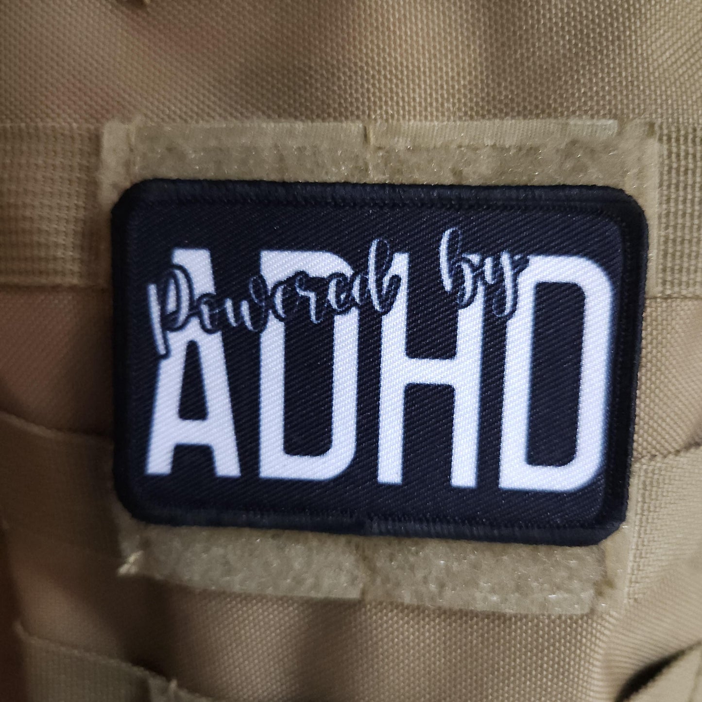 Powered by ADHD meme  2"x3" morale patch with hook and loop backing