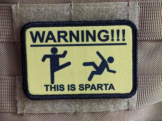 This is Sparta warning sign meme 2"x3" morale patch with hook and loop backing