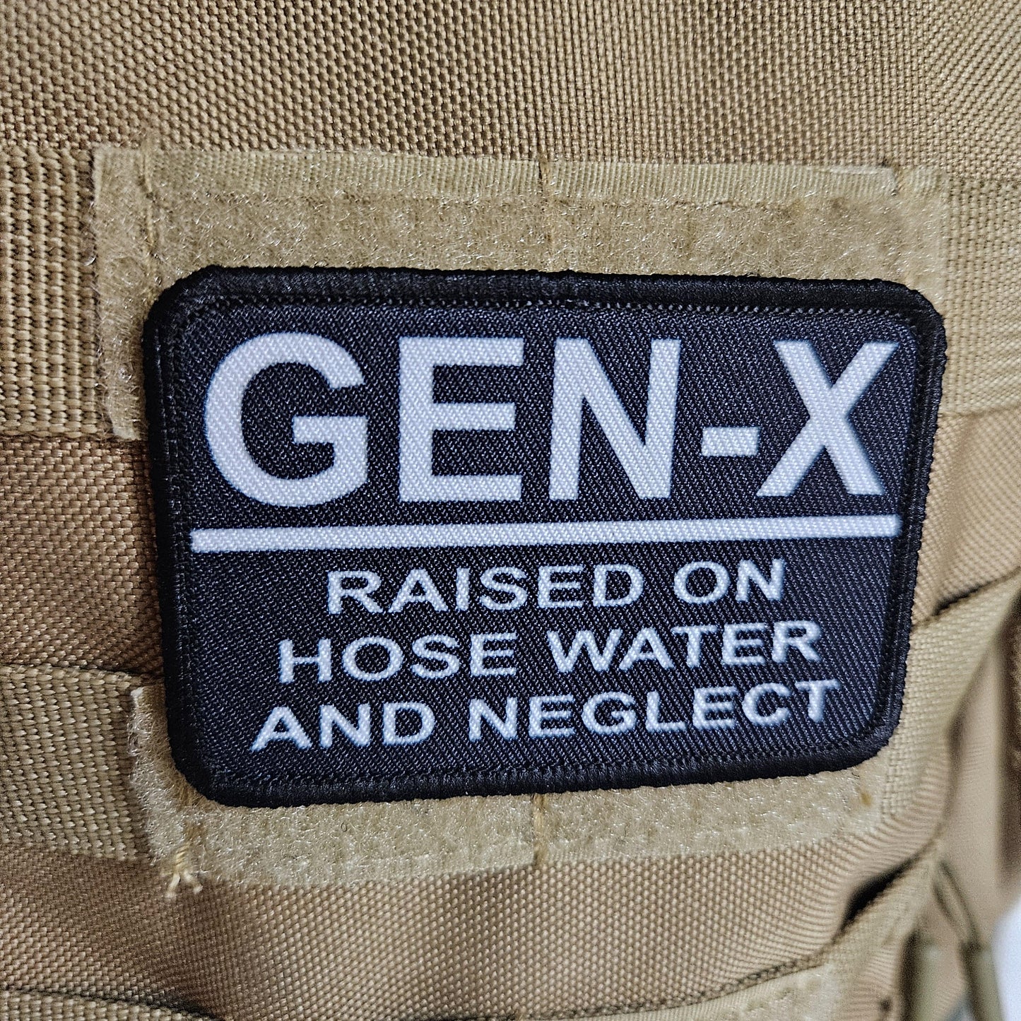 Gen x raised on hose water and neglect meme 2"x3" morale patch with hook and loop backing