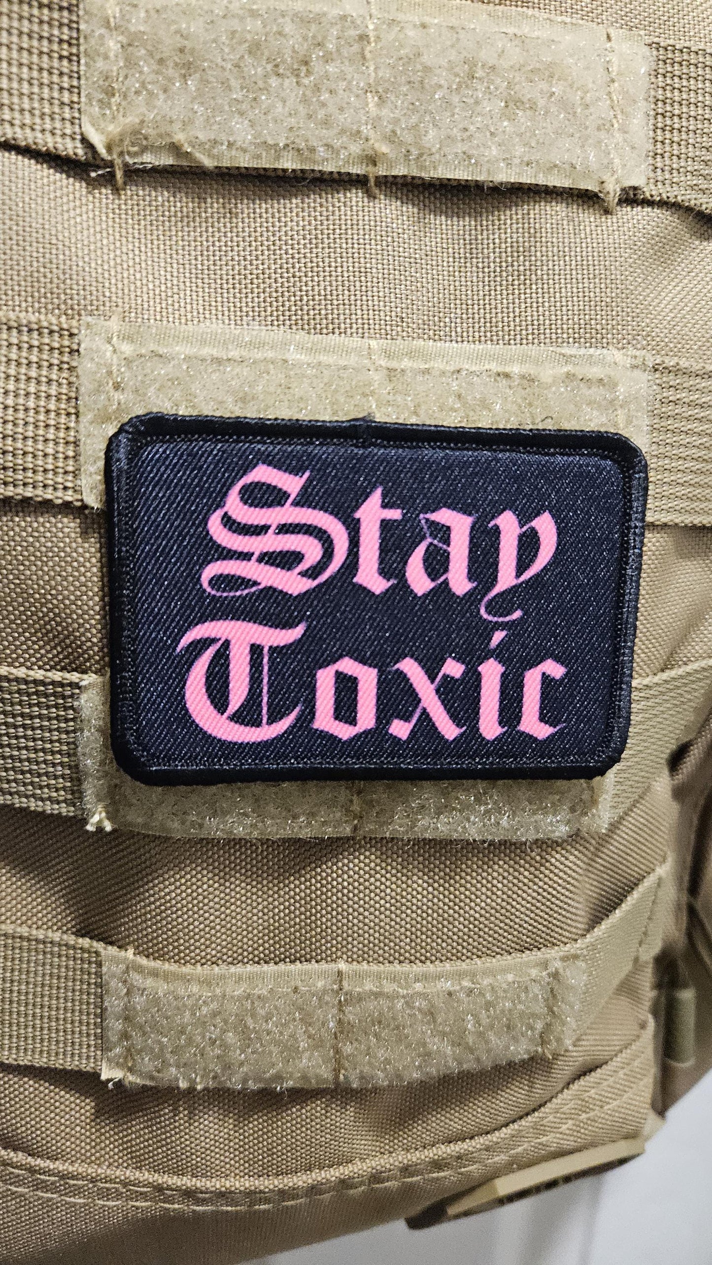 Stay toxic meme  pink on black 2"x3" removable morale patch with hook and loop backing