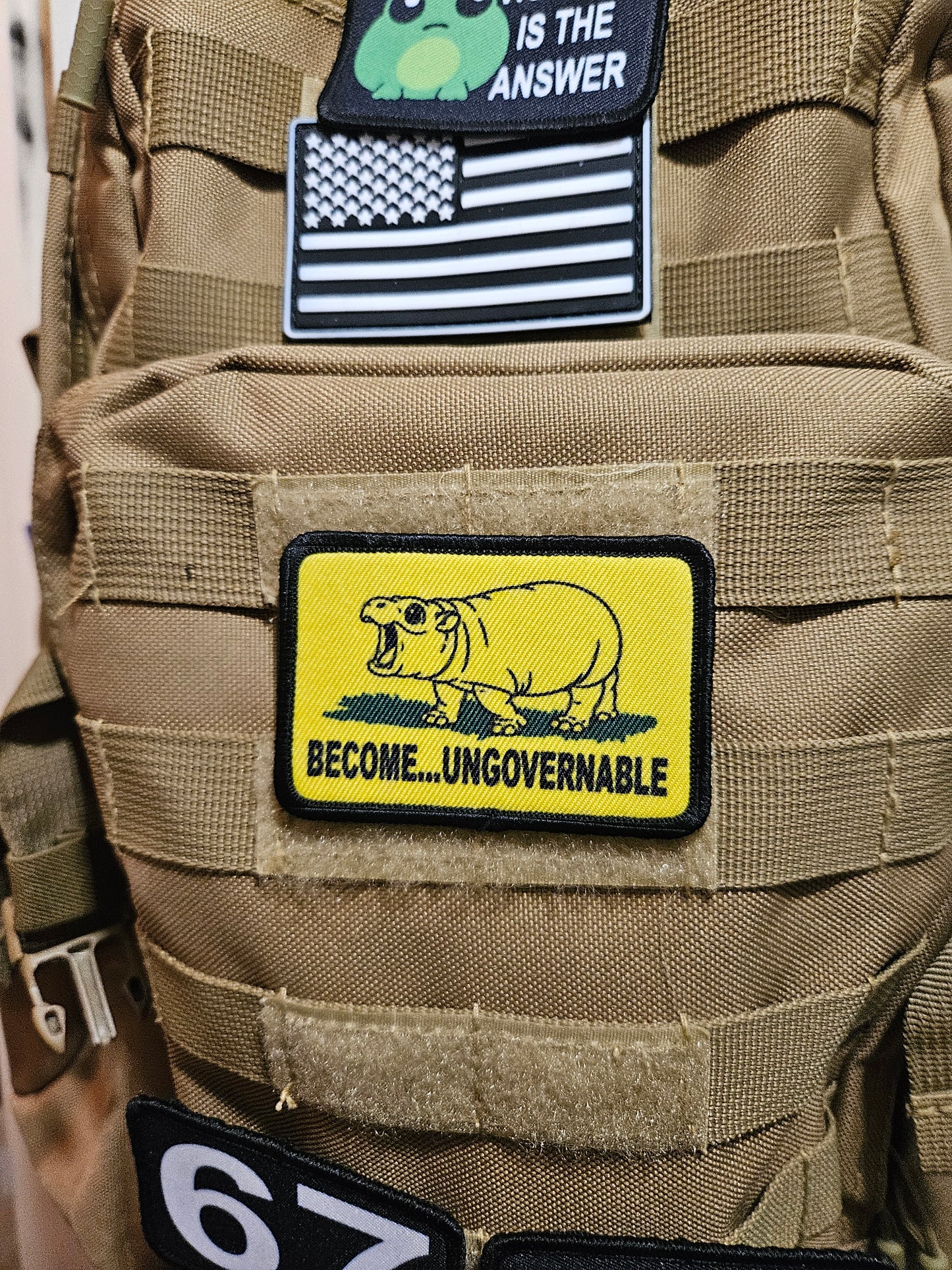 Become ungovernable baby hippo meme 2"x3" morale patch with hook and loop backing line art version