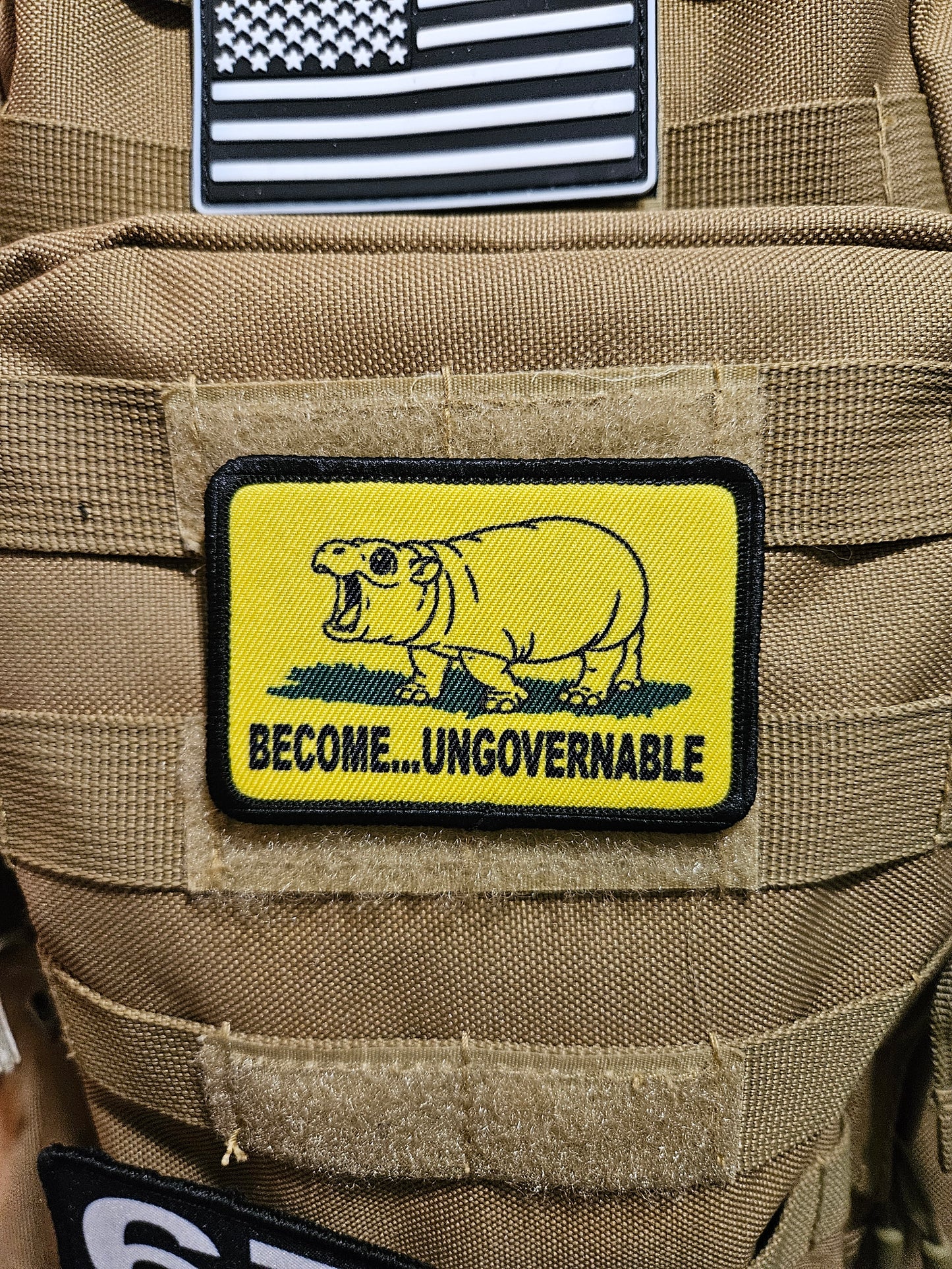 Become ungovernable baby hippo meme 2"x3" morale patch with hook and loop backing line art version