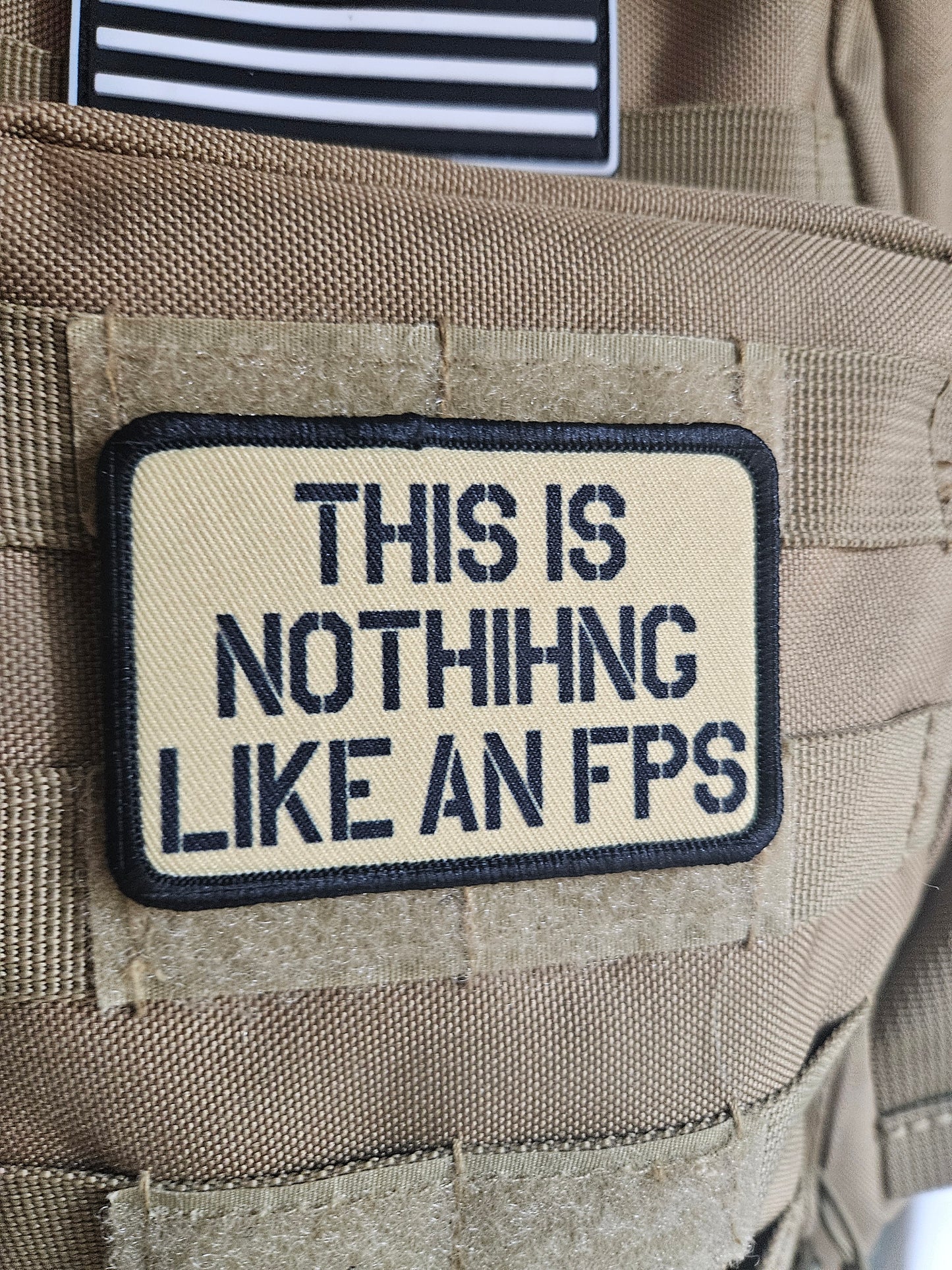 This is nothing like a first person shooter military meme 2"x3" removable morale patch with hook and loop backing