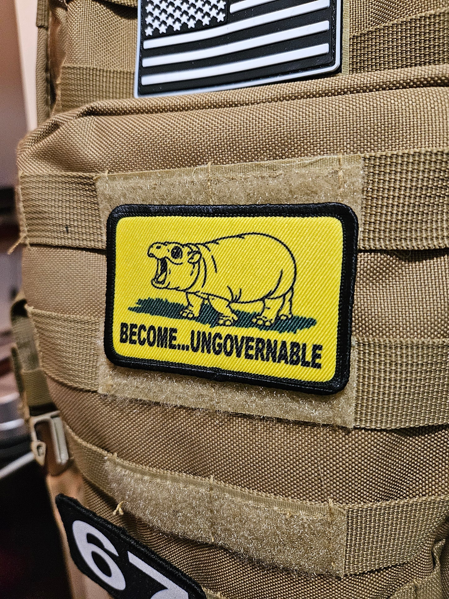 Become ungovernable baby hippo meme 2"x3" morale patch with hook and loop backing line art version
